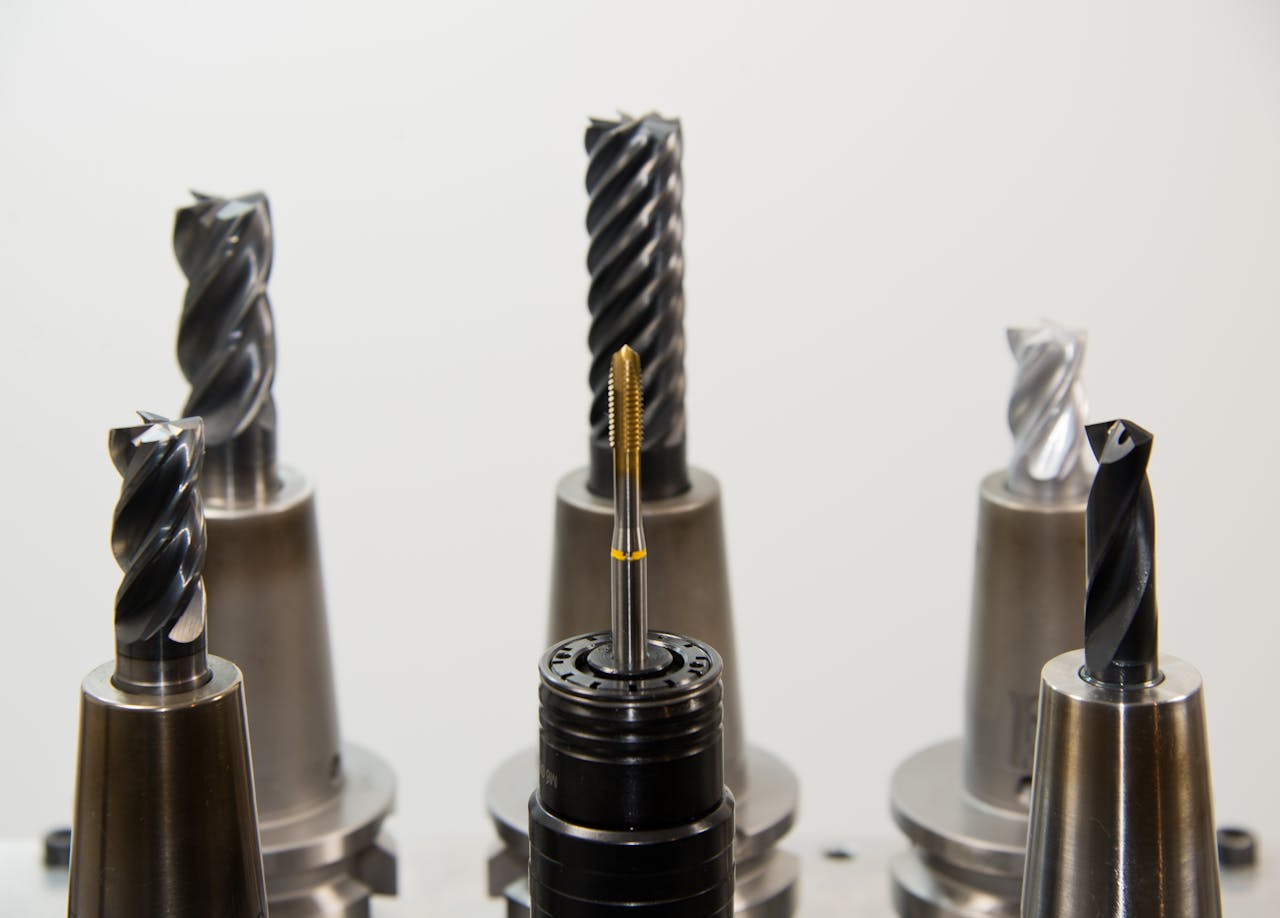 team-01 A detailed view of different drill bits used in industrial machining applications.